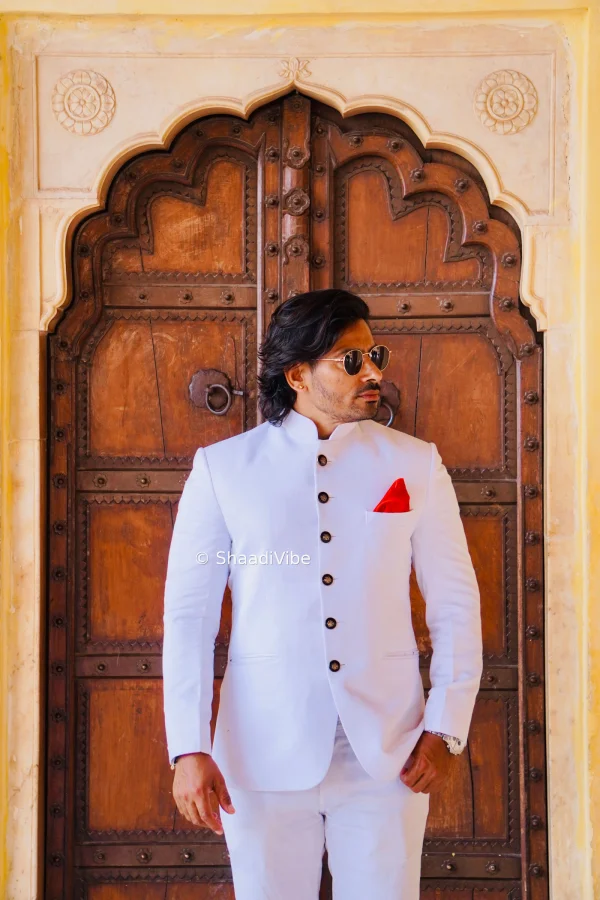 Relaxed groom pose featuring an Indian groom standing naturally with one hand in his pocket during his wedding portraits.