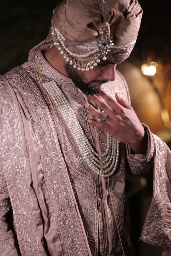 Candid Indian groom portrait capturing a genuine smile while getting ready for the wedding ceremony.