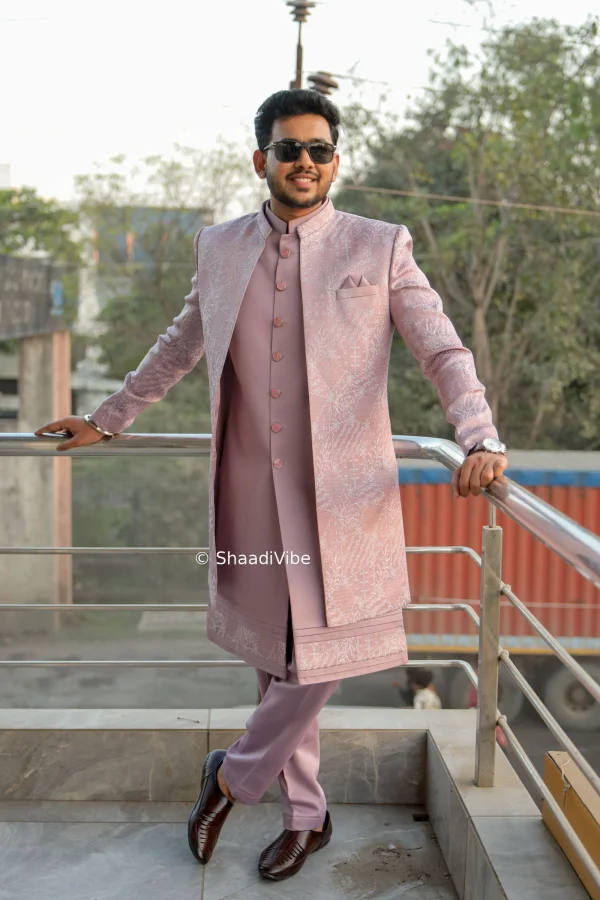 Confident Indian groom portrait featuring a contemporary sherwani and relaxed modern wedding pose.