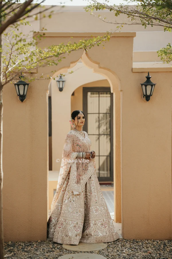 Elegant ivory bridal lehenga with delicate embroidery for a sophisticated and contemporary Indian bride.