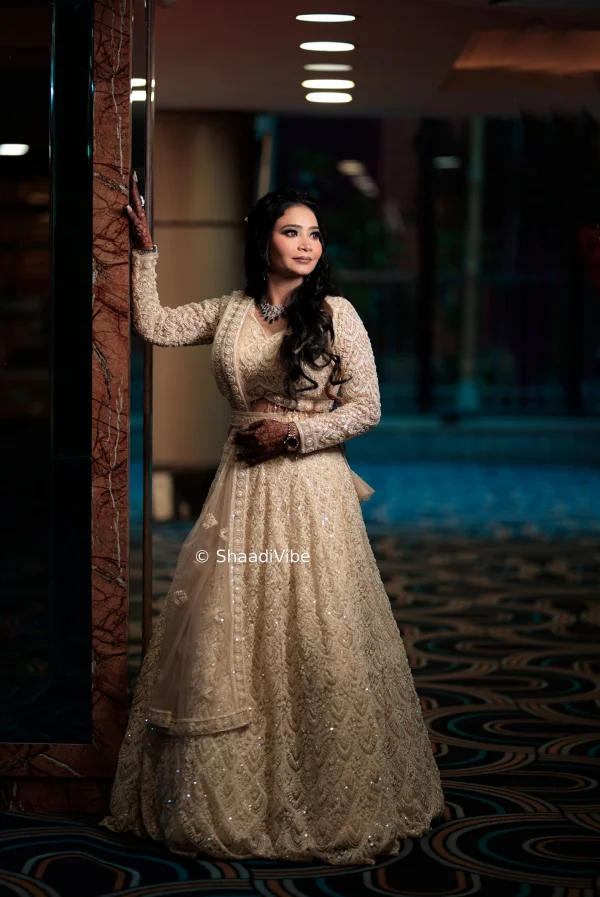 Minimal ivory lehenga with subtle embroidery for brides looking for an elegant and understated sangeet and reception outfit.