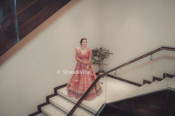 Contemporary blush pink bridal lehenga with delicate detailing for a modern and feminine Indian bridal outfit.