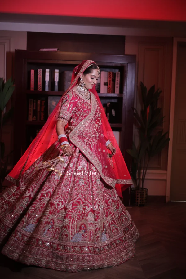 Red bridal lehenga featuring intricate embroidery  with the palm tree embroidery and traditional detailing for a timeless Indian wedding look.