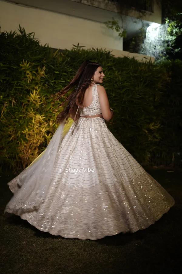 Elegant ivory bridal lehenga with delicate embroidery all over for a sophisticated and contemporary Indian bride.