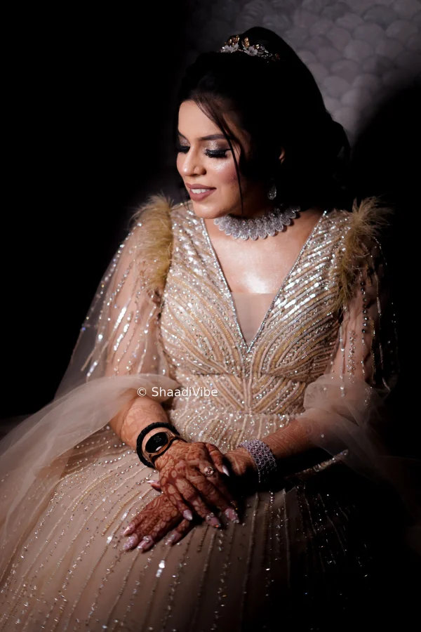 Graceful Indian bride portrait featuring a detailed bridal hairstyle, statement earrings and traditional wedding jewellery.