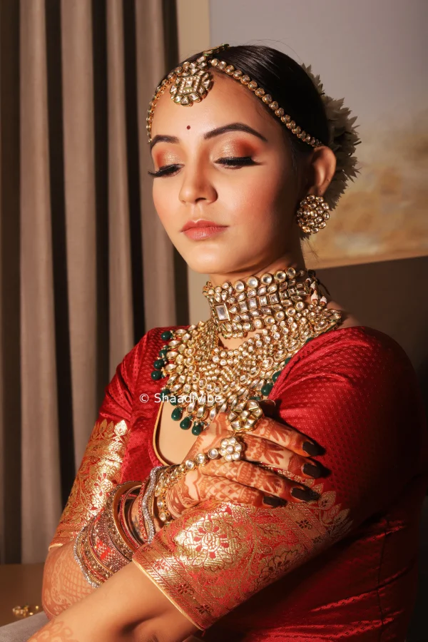 Modern Indian bridal portrait featuring contemporary styling, elegant jewelry and a sophisticated wedding outfit.