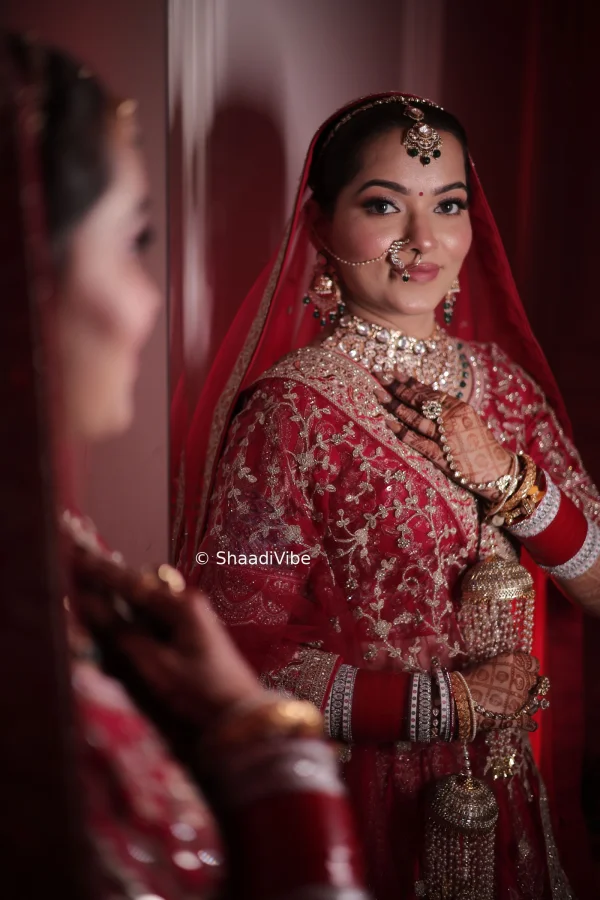Close-up bridal portrait highlighting intricate jewellery, bridal makeup and traditional Indian wedding styling.