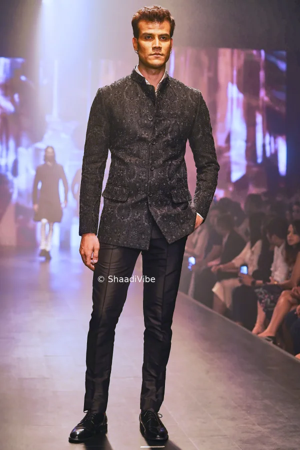 Stylish black jodhpuri set  featuring detailed embroidery for a sophisticated and contemporary groom look.