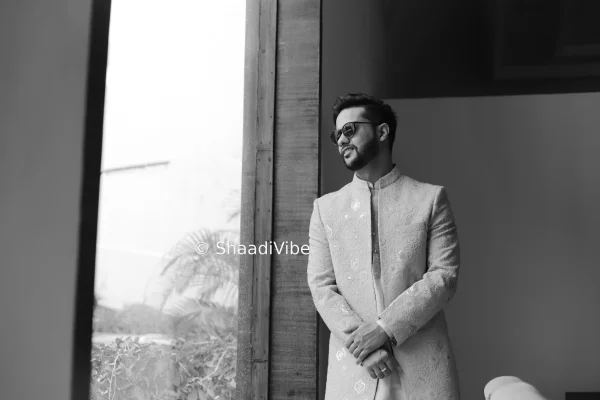 Contemporary ivory sherwani with subtle detailing for a clean and stylish modern groom aesthetic.