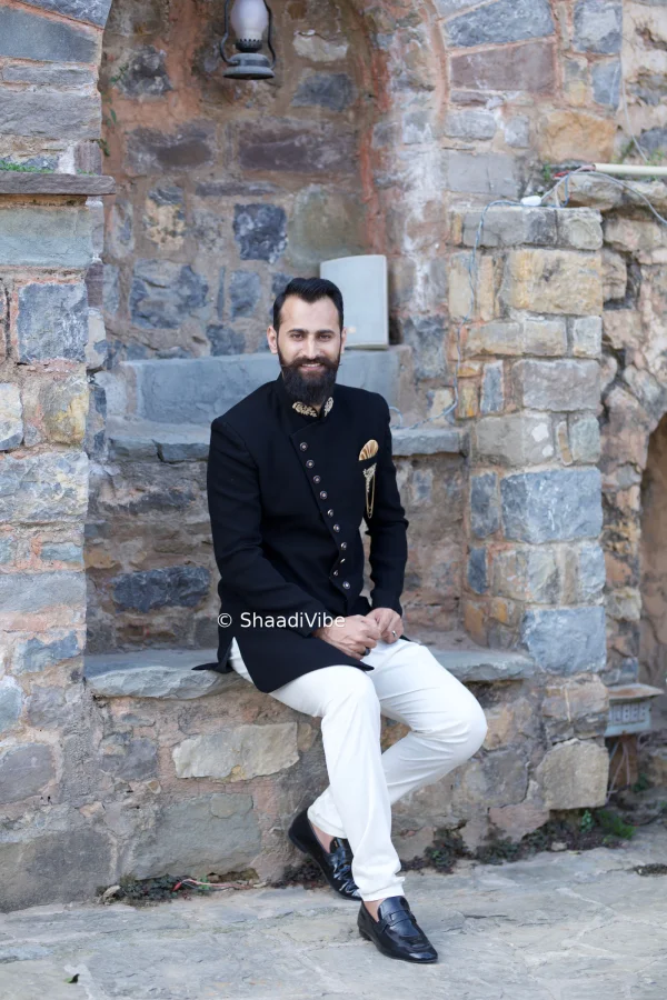 Classic maroon indo western with detailed embroidery on a collar for a rich and traditional Indian wedding groom look.