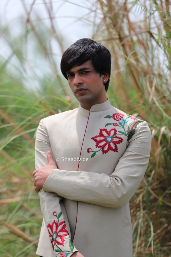 Minimal ivory jodhpuri with dual tone thread embroidery and classic styling for an elegant and understated groom look for pre wedding festivities.