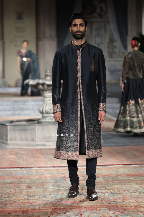 Stylish black sherwani featuring detailed embroidery for a sophisticated and contemporary groom look.