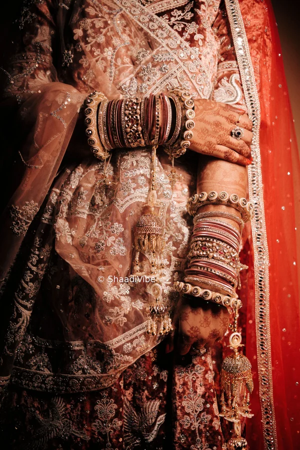 Traditional Indian bride posing with her hands together to create a graceful and culturally inspired wedding photograph.