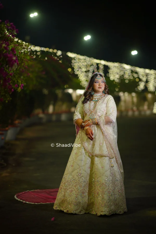Traditional Indian bride posing with her hands together to create a graceful and culturally inspired wedding photograph.