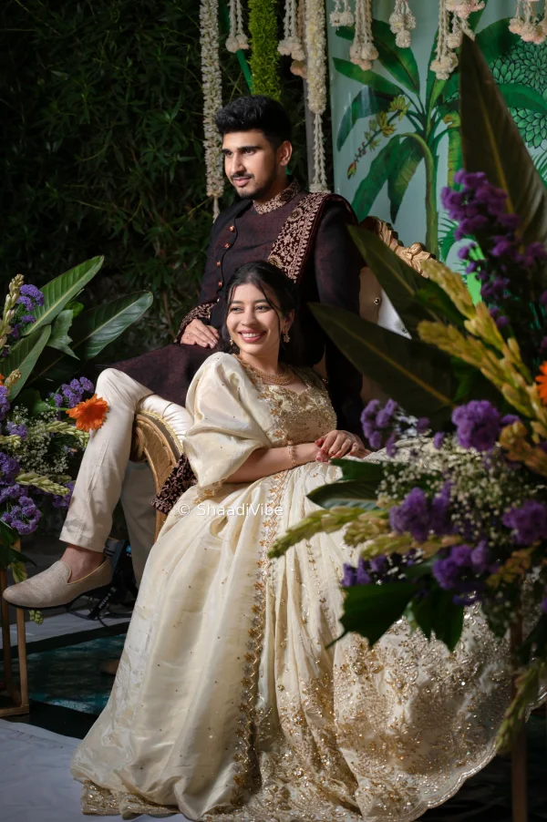 Classic bride and groom pose featuring the couple standing together in coordinated wedding outfits for a timeless pre wedding festivities photograph.