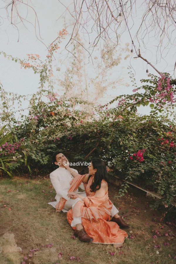 Fun and candid pre-wedding photograph capturing the couple laughing together and enjoying their photoshoot experience.