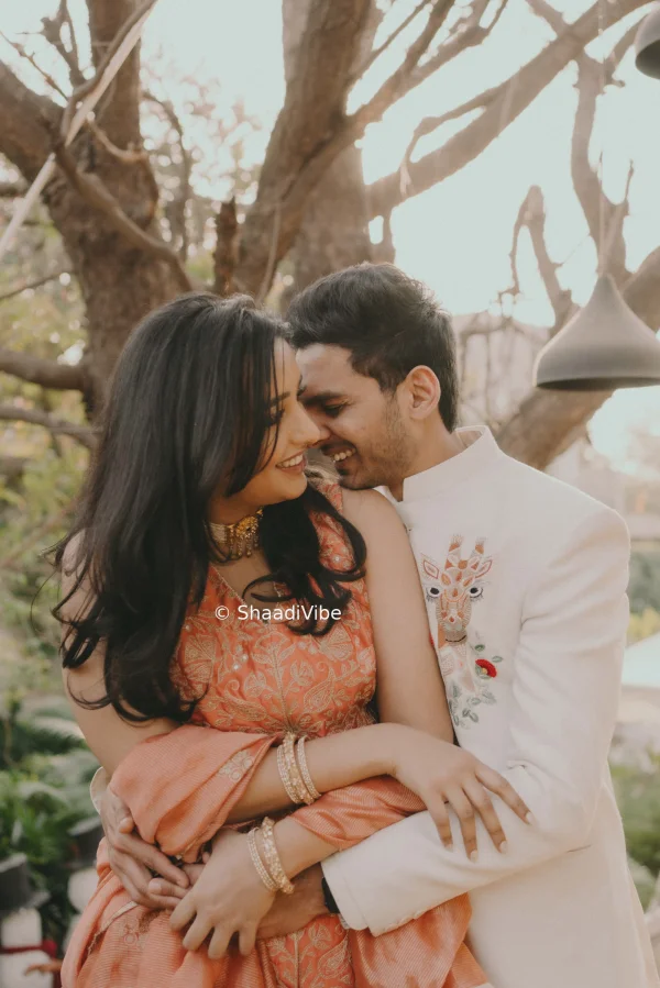 Playful pre-wedding couple pose capturing laughter and natural chemistry between the bride and groom during their photoshoot.