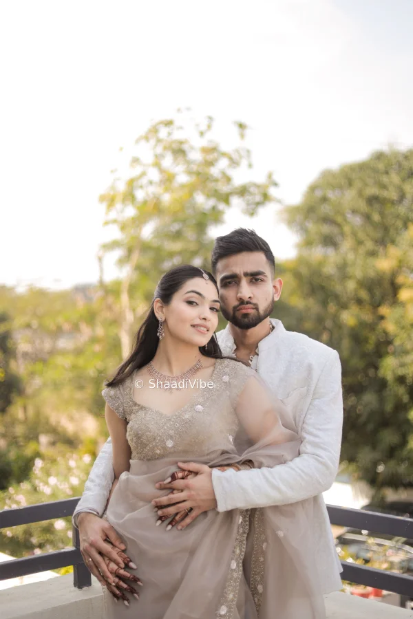 Fun and candid pre-wedding photograph capturing the couple laughing together and enjoying their photoshoot experience.