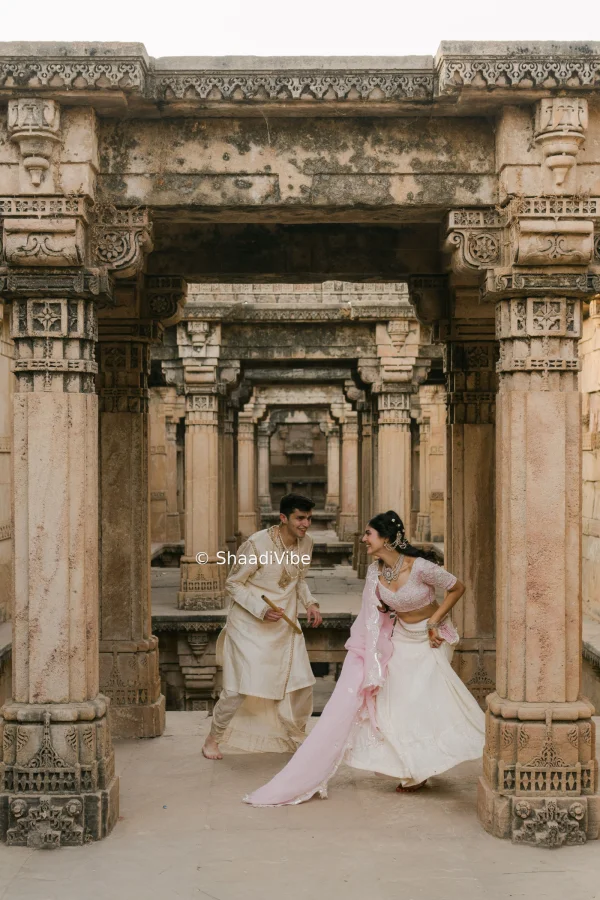 Playful pre-wedding couple pose capturing laughter and natural chemistry between the bride and groom during their photoshoot.