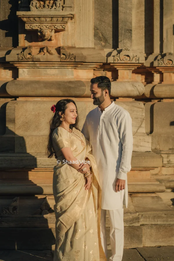 Natural pre-wedding couple pose featuring the bride and groom sitting together and enjoying a quiet moment during their photoshoot.