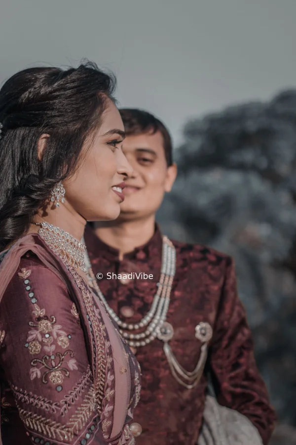 Elegant bride and groom portrait captured during the wedding ceremony, highlighting their traditional outfits and natural chemistry.