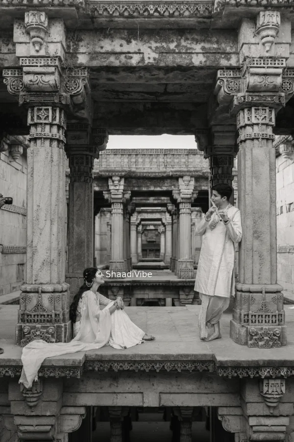 A classic shoot at Step well. looks dreamy, Dreamy pre-wedding couple portrait featuring the bride and groom standing close together against a scenic outdoor backdrop.
